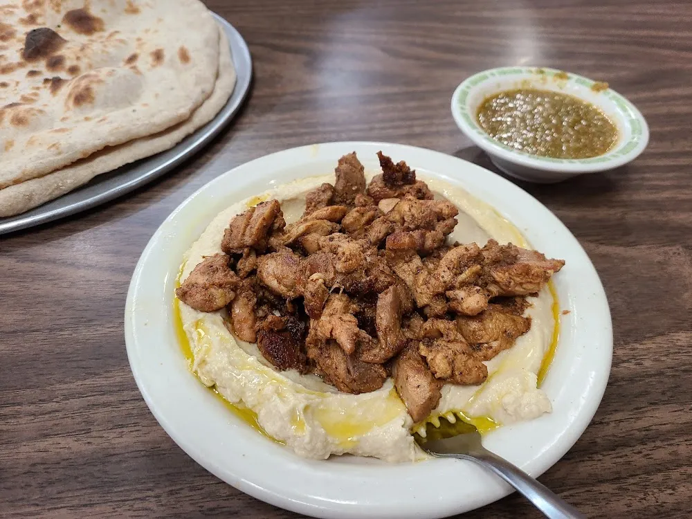 Chicken Shawarma over Hummus